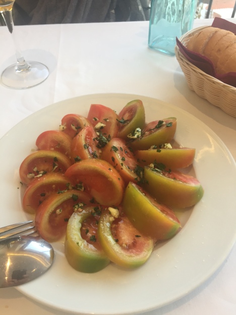 picture of tomatoes cut and placed on a plate
